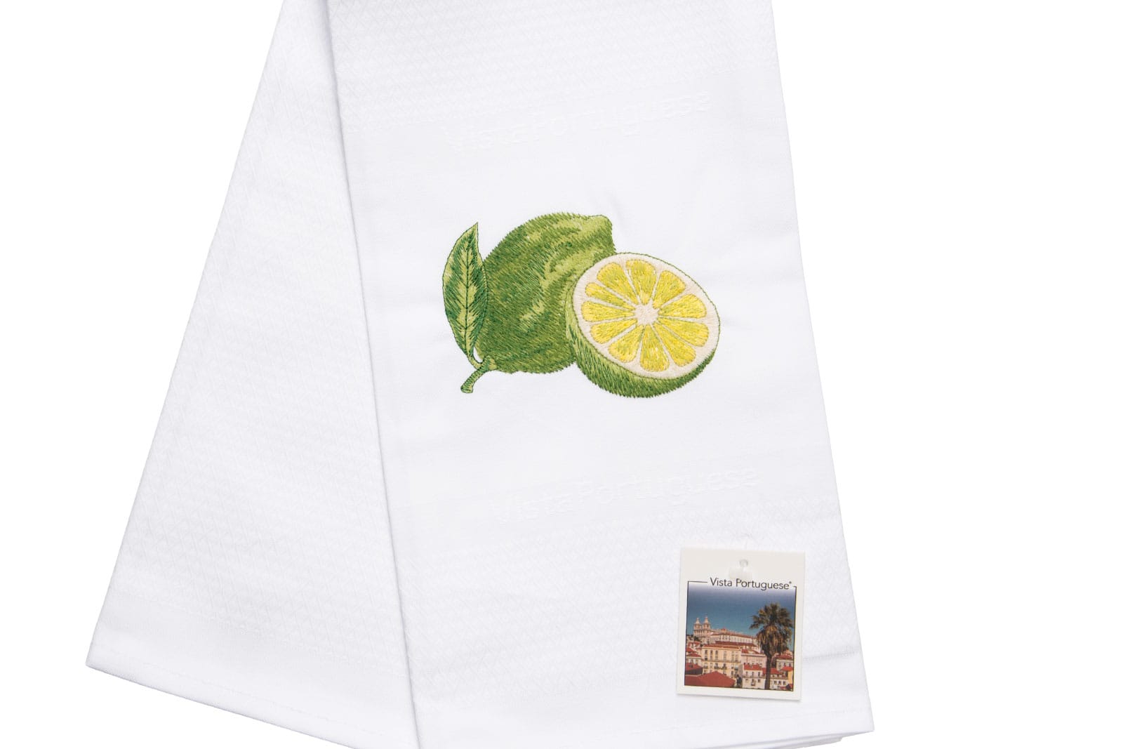 Ausschnitt des Geschirrtuch Lime / Limette 50x70cm von Vista Portuguese. Es ist ein weißes Geschirrhandtuch aus Jacquardstoff mit aufgesticktem Limettenmotiv.