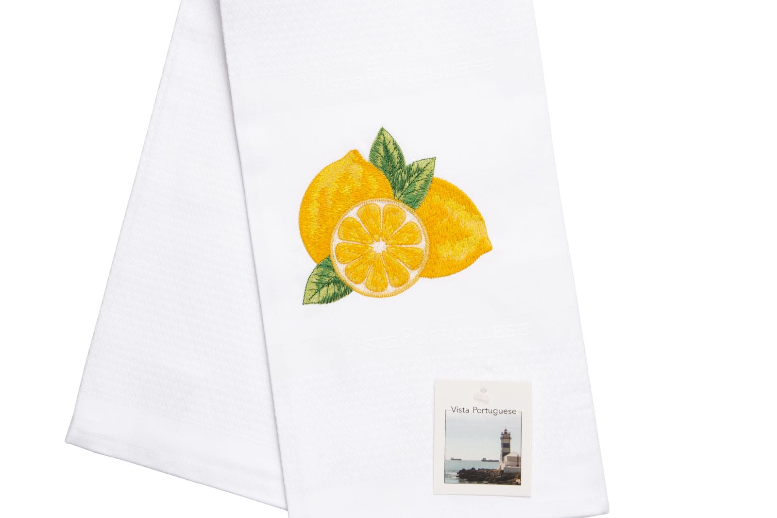 Ausschnit aus dem Geschirrtuch Lemon / Zitrone 50x70cm von Vista Portuguese. Es ist ein weißes Geschirrhandtuch aus Jacquardstoff mit aufgesticktem Zitronenmotiv.